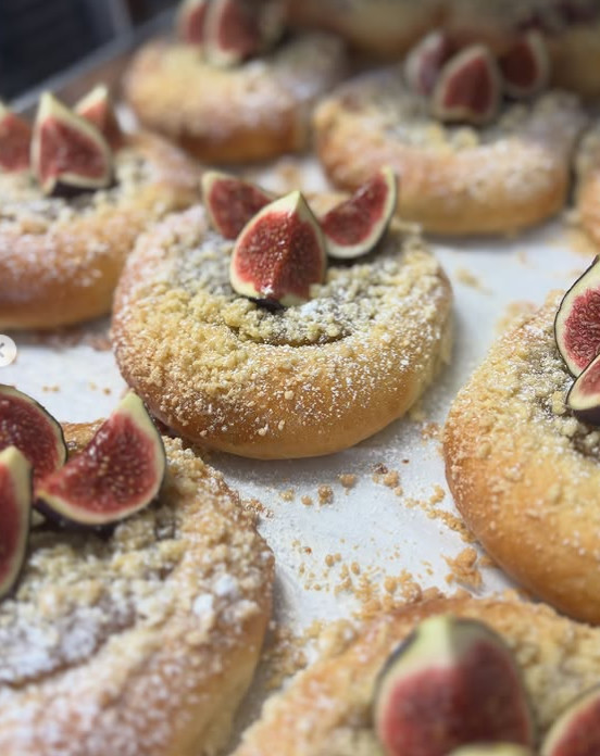 Seasonal fig and frangipane danishes dusted with sugar